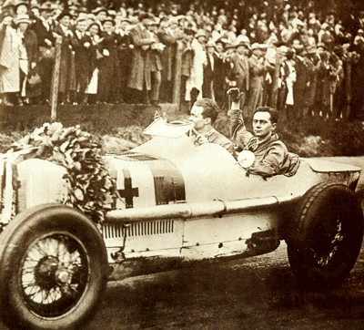 Rudolf Caracciola - der Regenmeister- on his lap of honour after his first major victory, in a Mercedes GP car at the German Grand Prix, Avus in 1926