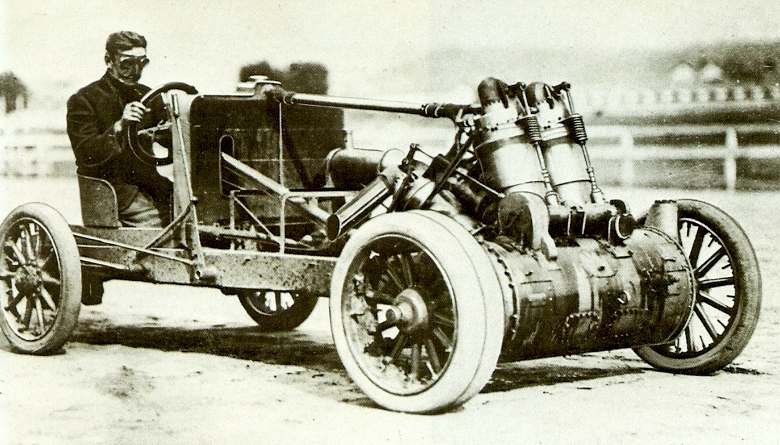 Walter Christie driving one of his own cars, which featured front-wheel drive and twin front wheels