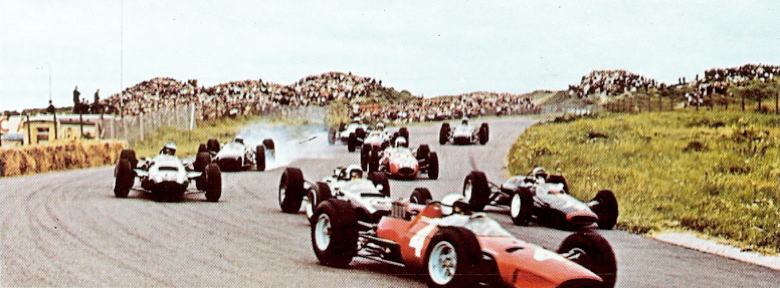 Lorenzo Bandini's Ferrari leads a group of cars during the 1965 Dutch Grand Prix