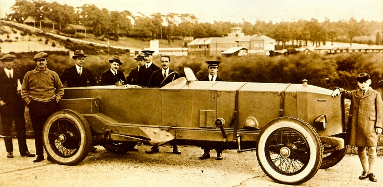 Lionel Rapson's racing 40hp seen at Brooklands with mechanics and others